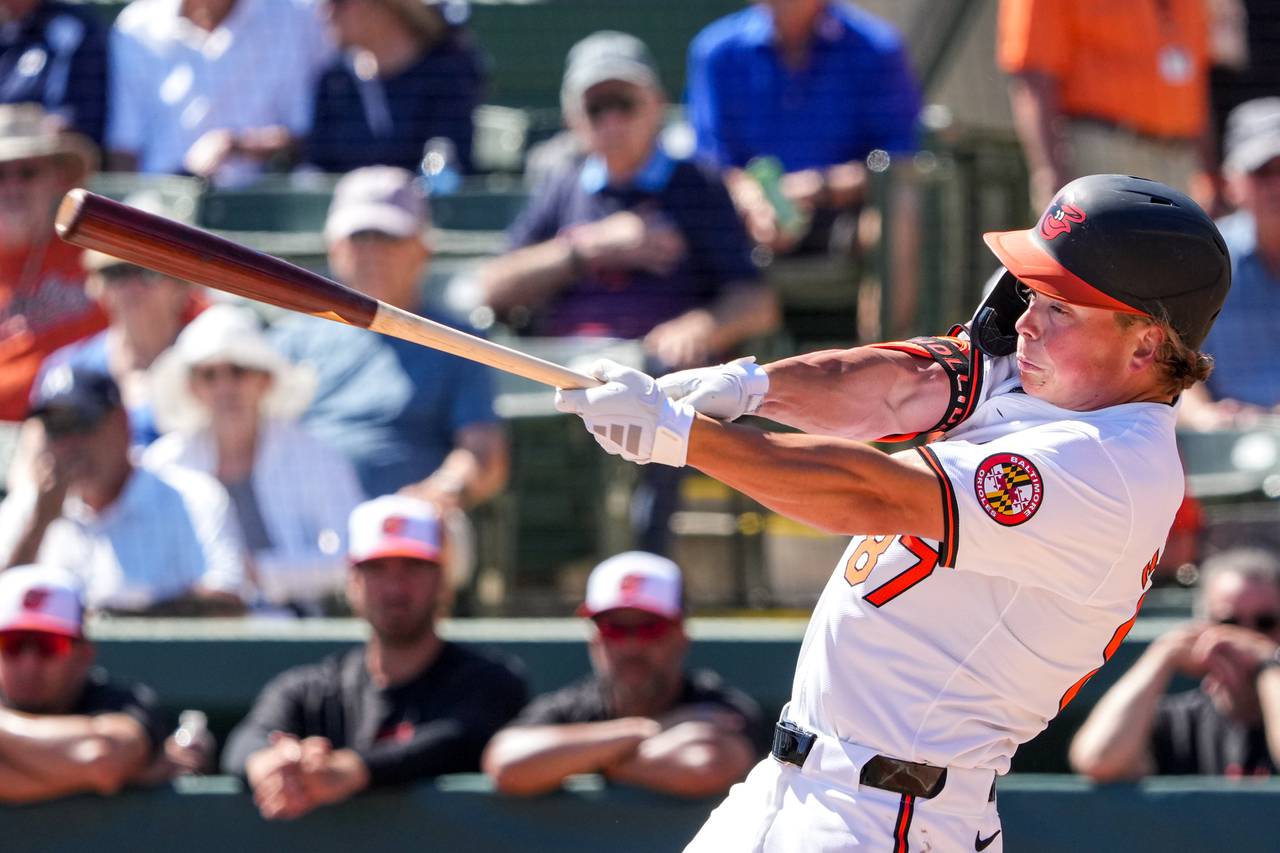 Baltimore Orioles second baseman Jackson Holliday (87) swings at a pitch during a Grapefruit League game against the Detroit Tigers at Ed Smith Stadium on February 27, 2024.