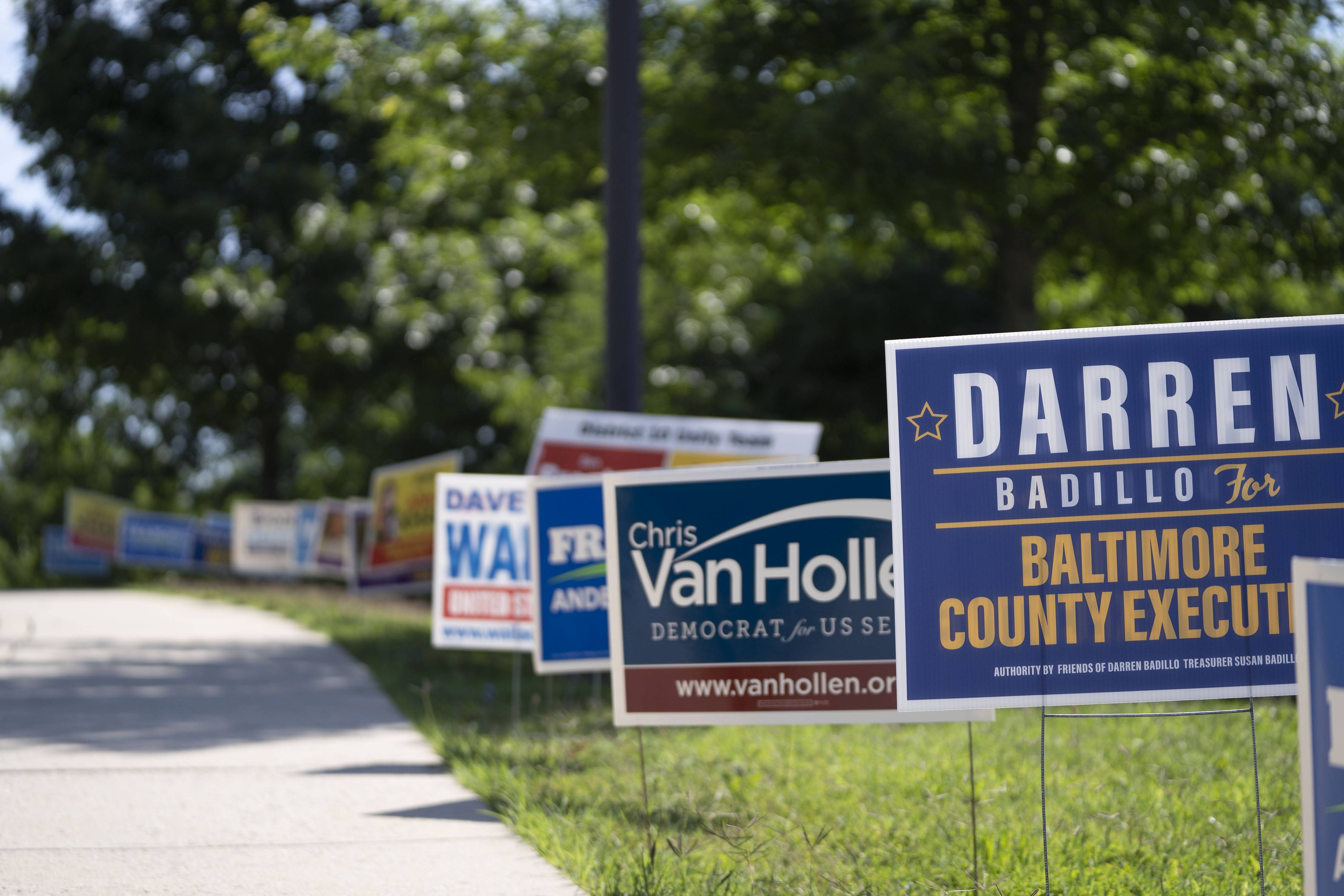 Campaign signs line the road leading to Arbutus Recreation Center, an early voting location in Baltimore County.