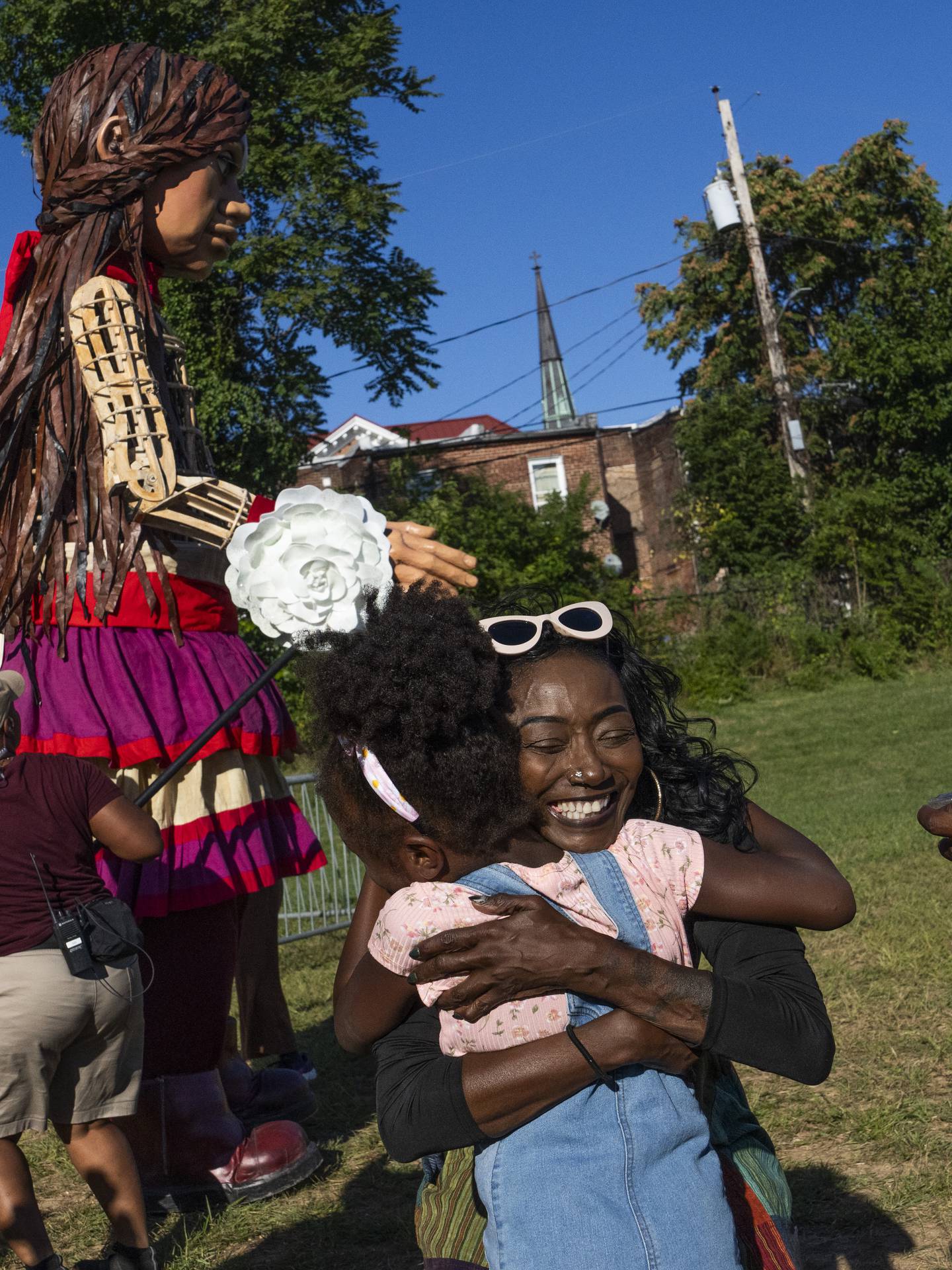 Little Amal, a twelve-foot puppet of a 10-year-old Syrian refugee girl, visits Robert C Marshall Park in West Baltimore on September 16, 2023.