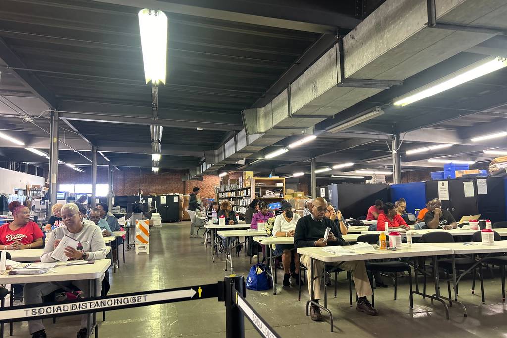 Baltimore City Board of Elections workers open mail-in ballots at the board's West Baltimore warehouse on Thursday, May 16.