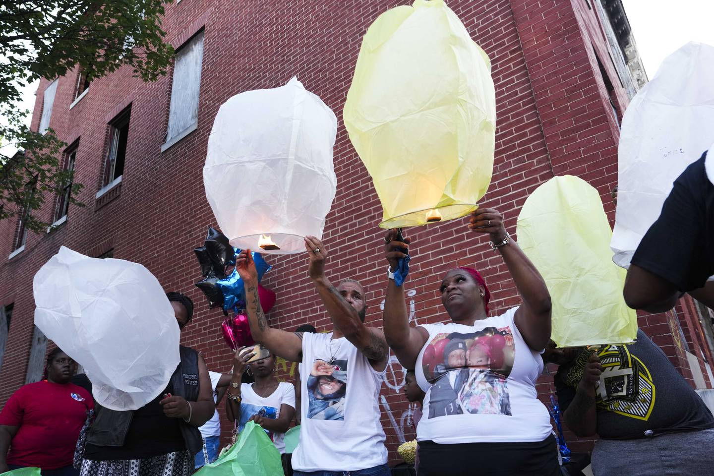 Ty and Tamika L let lanterns go at a vigil in honor of their son, Kylis Fagbemi, 20, on July 11, 2023. Fagbemi was shot and killed at a Brooklyn Homes block party on July 2, 2023.