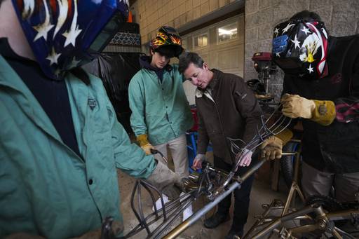 August DiMucci gives helpful suggestions for welding a metal moose head onto the front of a bike with Dodge Roberts, Carter Maloney, and Oliver Smulyan.