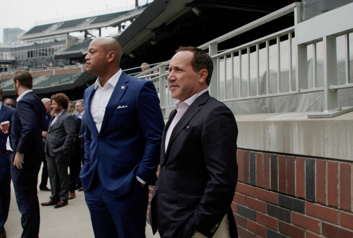 A screengrab from an Orioles video shows Gov. Wes Moore, left, standing next to Orioles CEO John Angelos at Truist Park in Atlanta.