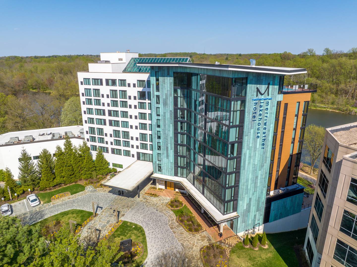 The Marriott Autograph Hotel that sits next to the 1970s-era lodge-style buildings on the shores of Lake Kittamaqundi in downtown Columbia. Costello Construction completed the hotel in November 2021. Photo courtesy David Costello.