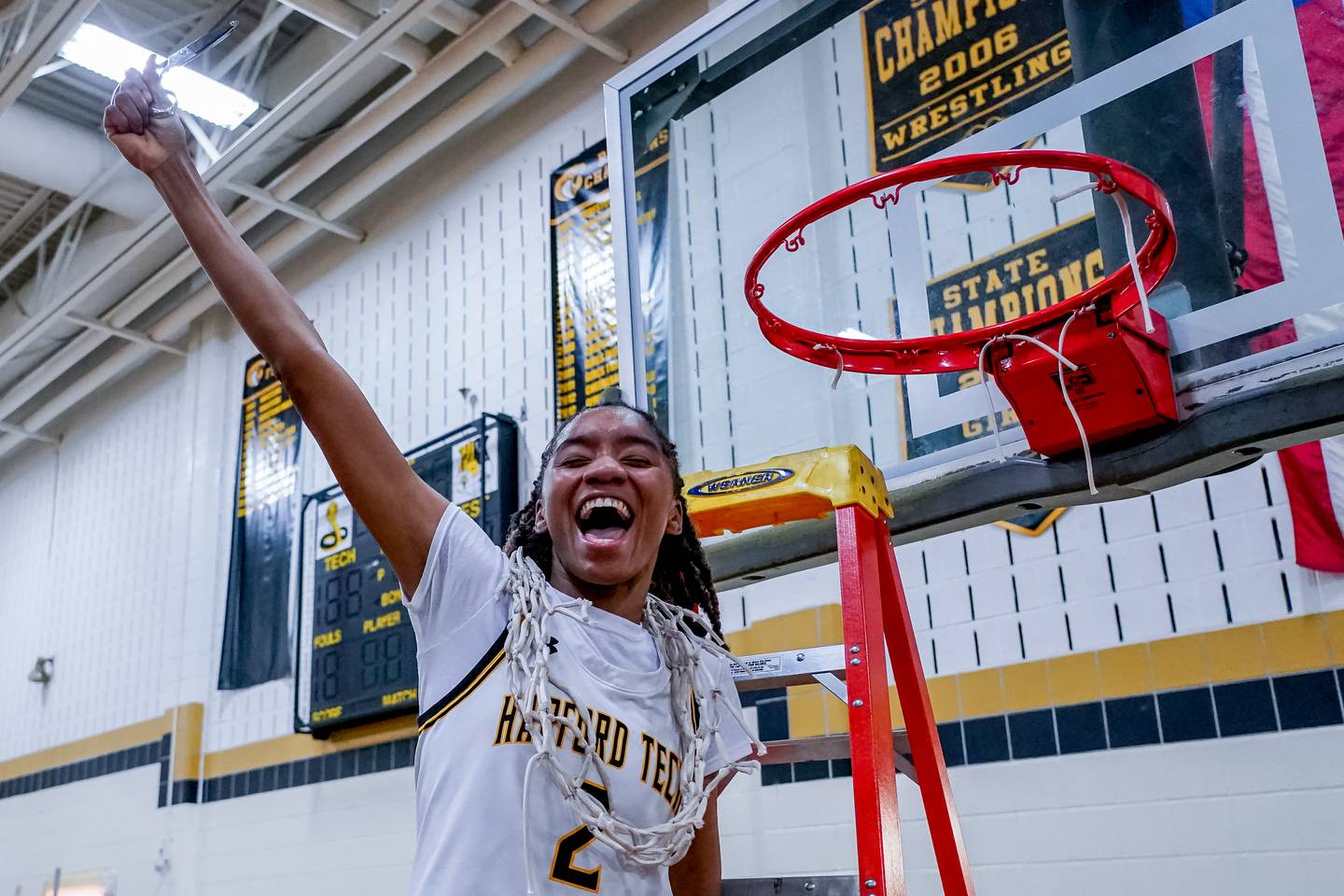 Harford TechÕs Anyia Gibson celebrates after cutting down the net after the MPSSAA High School Girls 2A East Region Playoff Final between the Fallston Cougars and Harford Tech Cobras at Harford Tech High School in Bel Air, Maryland on March 1, 2023. Harford Tech won 41-27. photo by Scott Serio for The Baltimore Banner