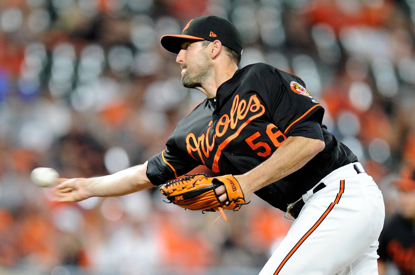 BALTIMORE, MD - JUNE 15:  Darren O'Day #56 of the Baltimore Orioles pitches in the ninth inning against the Miami Marlins at Oriole Park at Camden Yards on June 15, 2018 in Baltimore, Maryland.