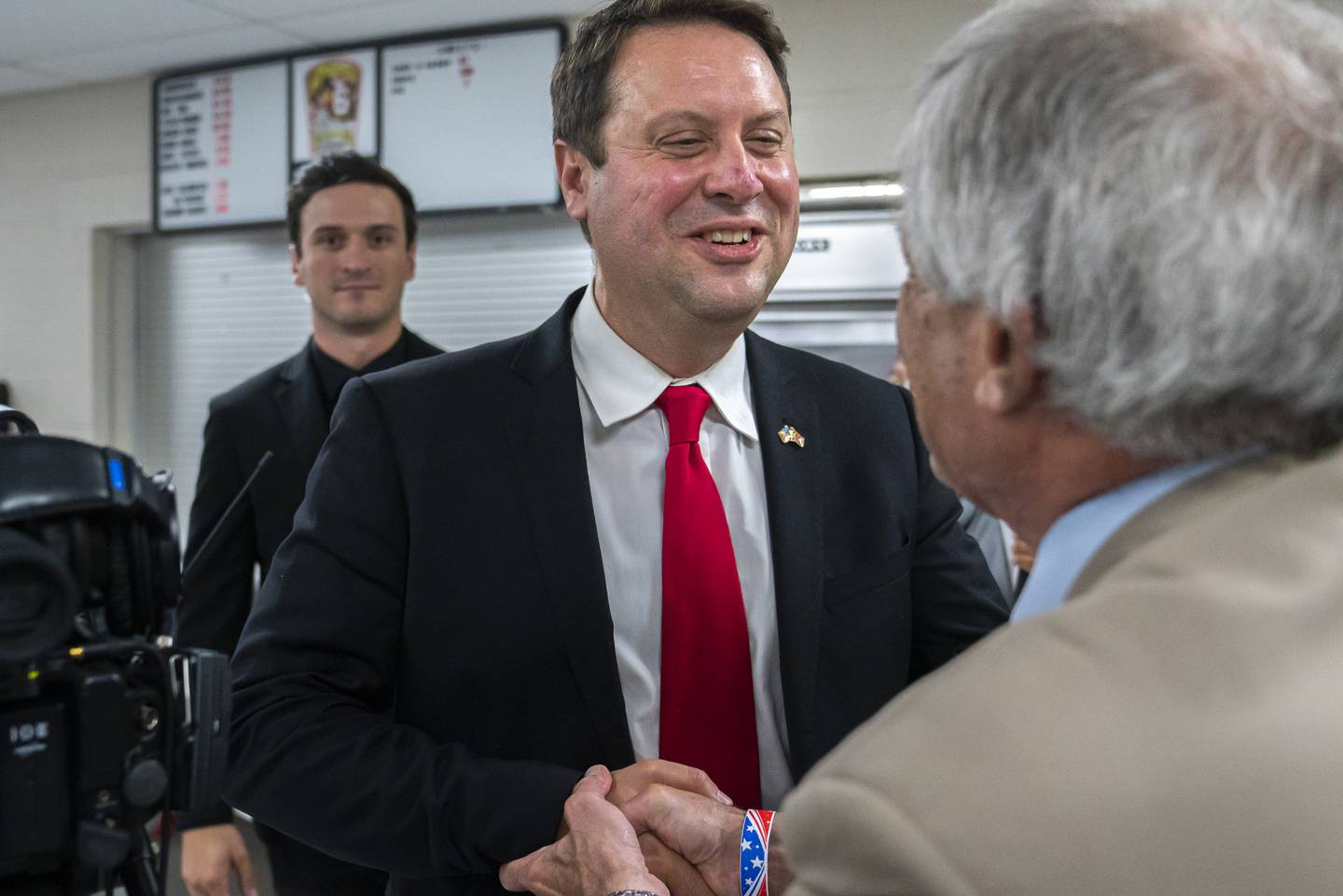 Dan Cox, a candidate for the Republican gubernatorial nomination, greets supporters during a primary election night event on July 19, 2022 in Emmitsburg, Maryland. Voters will choose candidates during the primary for governor and seats in the House of Representatives in the upcoming November election.