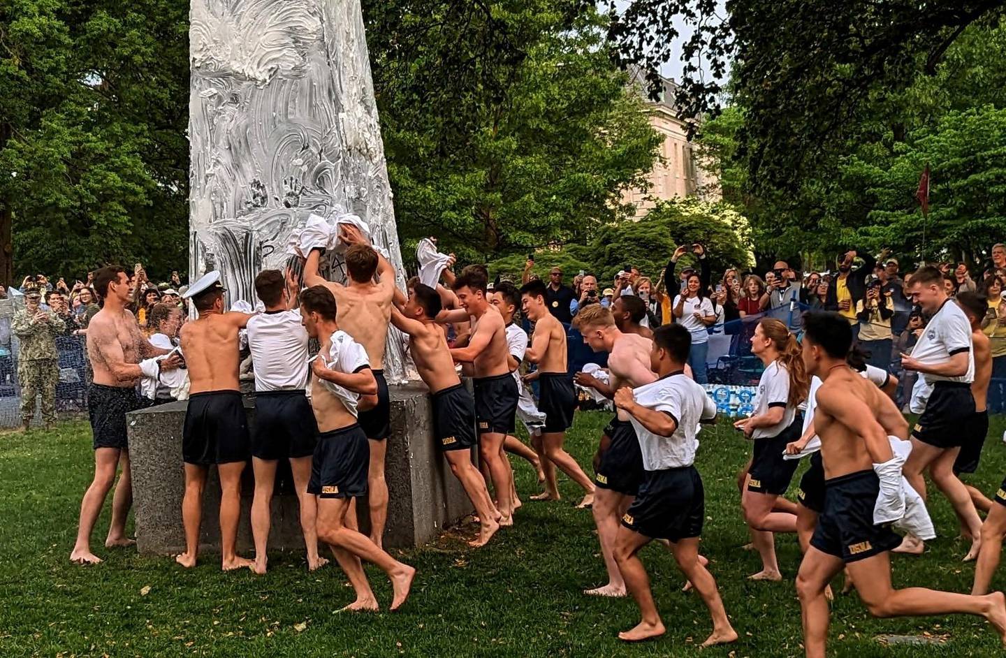 Plebes take part in the Herndon Monument climb at the U.S. Naval Academy on the morning of May 17, 2023.