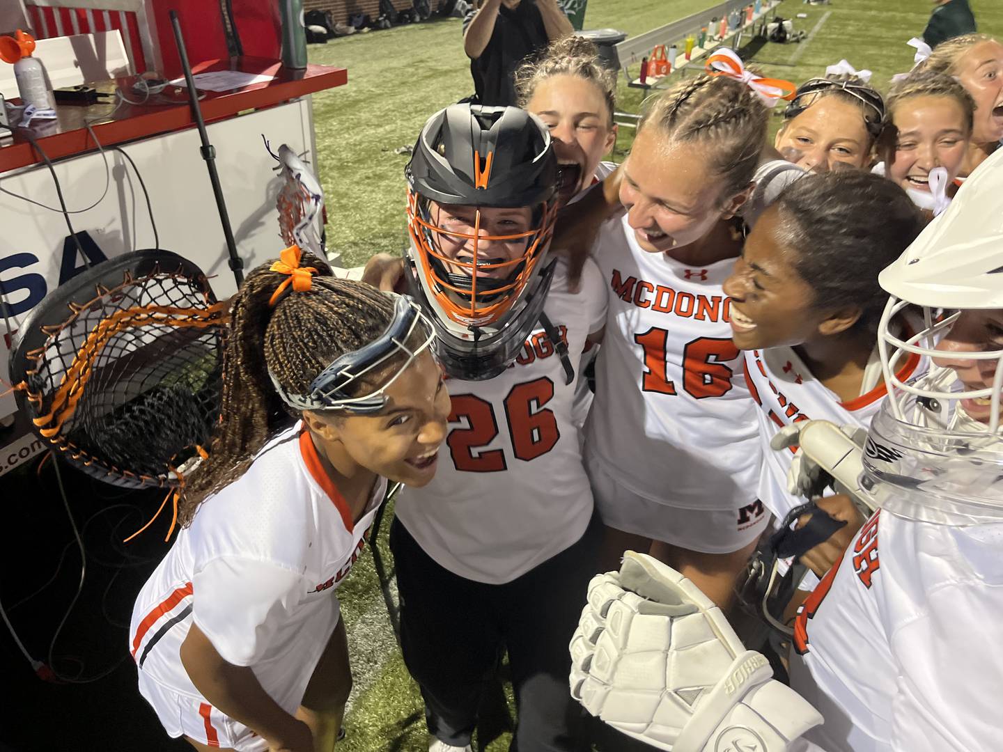 McDonogh goalie Reagan O'Donovan (26) is congratulated by her teammates following Friday's IAAM A Conference lacrosse championship game. The freshman came up big with 9 saves as the top-ranked Eagles defeated No. 2 St. Paul's at USA Lacrosse's Tierney Field.