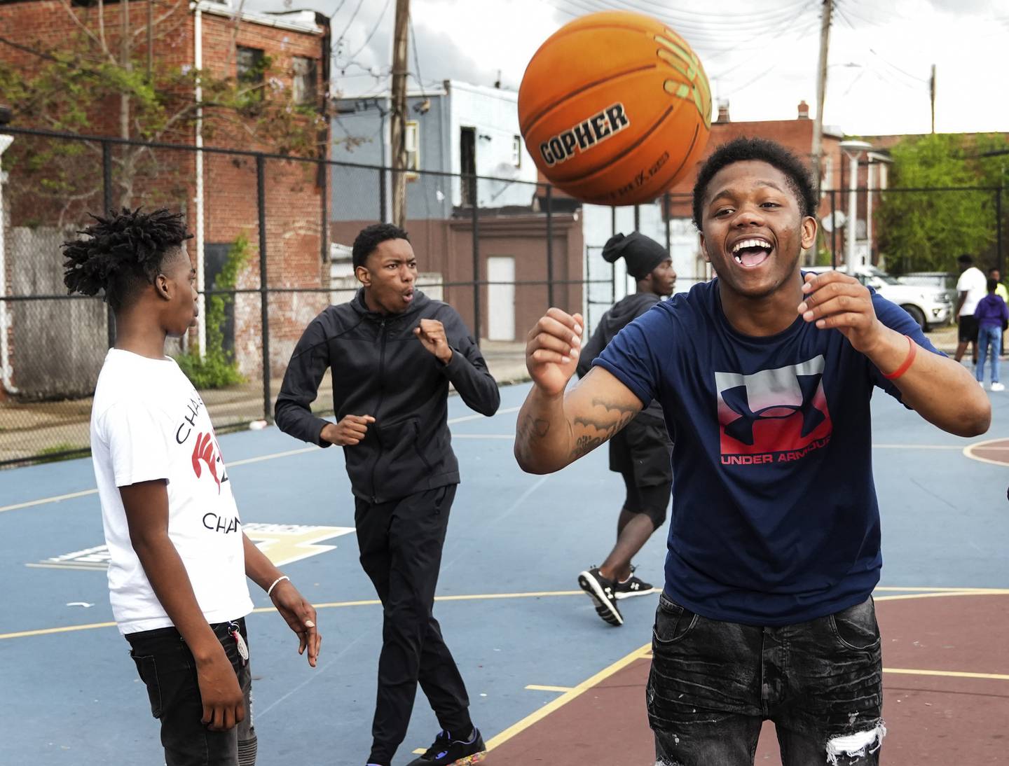 Myron Green, reacts after his friends missed a shot during a pick up game of basketball, at Tench Tilghman Basketball Court, in Baltimore, April 15, 2023.