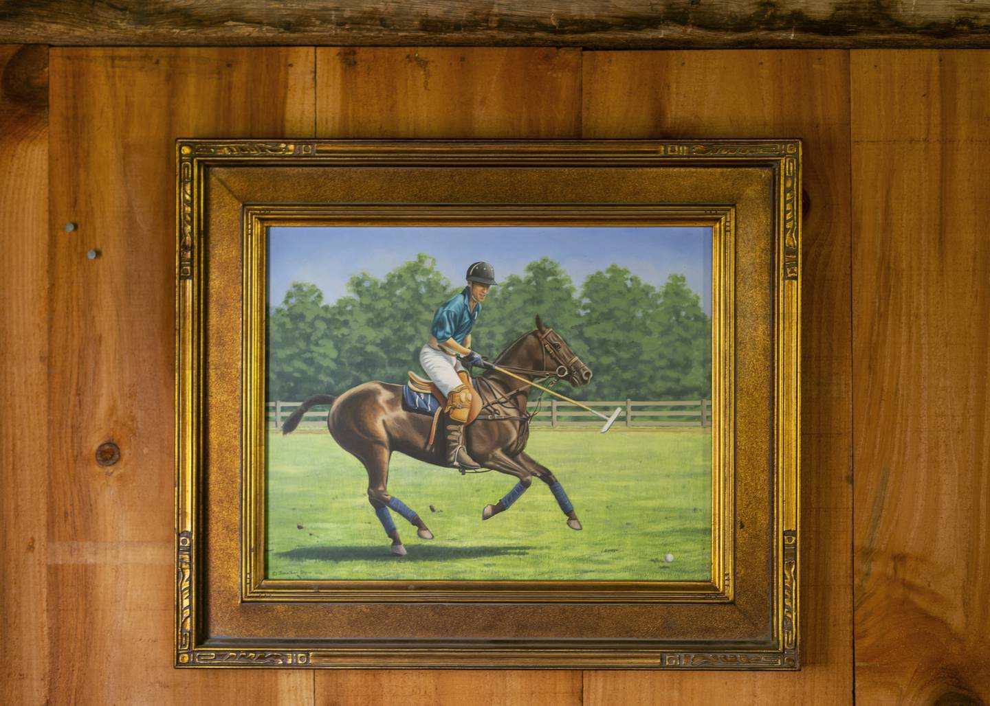 A painting by Jon shaw of a friend on one of his polo ponies at Mashomac Polo Club, New York hangs on the wall of a converted store house at the Emory Farm on August 4th, 2022 in Queenstown Maryland