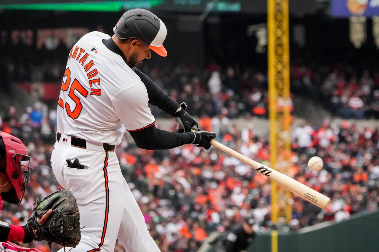 Baltimore Orioles right fielder Anthony Santander (25) hits the first home run of the season in a game against the Los Angeles Angels on Opening Day at Camden Yards on Thursday, March 28, 2024. The Baltimore Orioles won their first game of the season, 11-3, against the Angels.