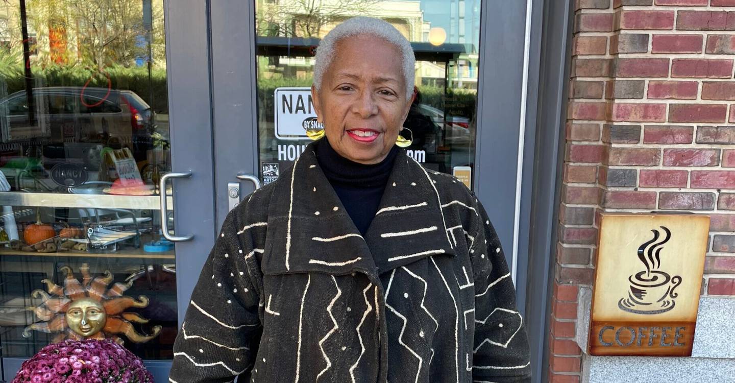 Wanda Watts stands in front of a restaurant in Baltimore.