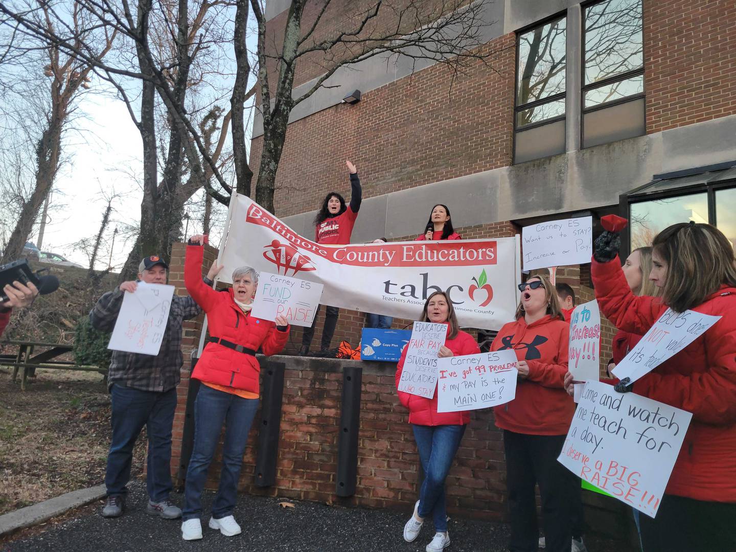 Educators of Baltimore County Public Schools rally for better pay outside the Baltimore County board of education building in Towson.