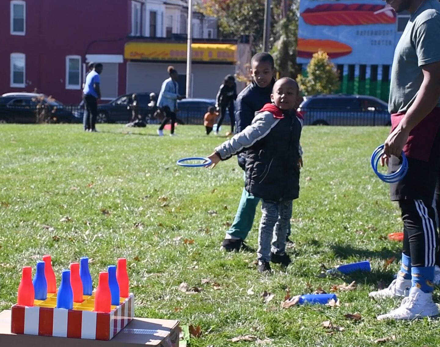 A child plays ring toss at the East Baltimore Graffiti Church's Fall Festival.