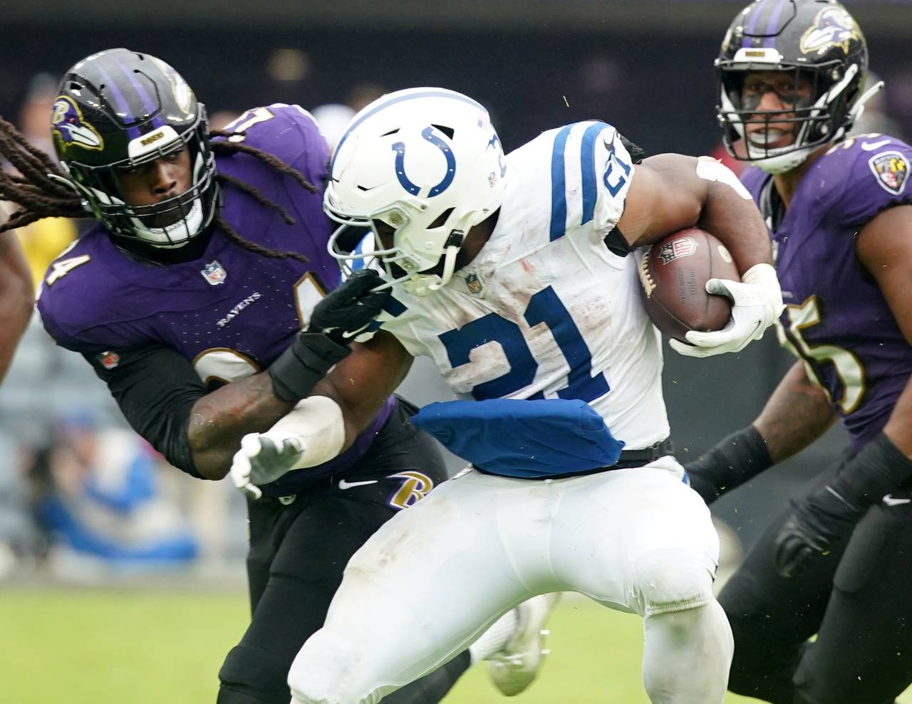 Baltimore Ravens linebacker Jadeveon Clowney (24) gats away with a face mask against Indianapolis Colts running back Zack Moss (21) in a 22-19 loos to the colts.