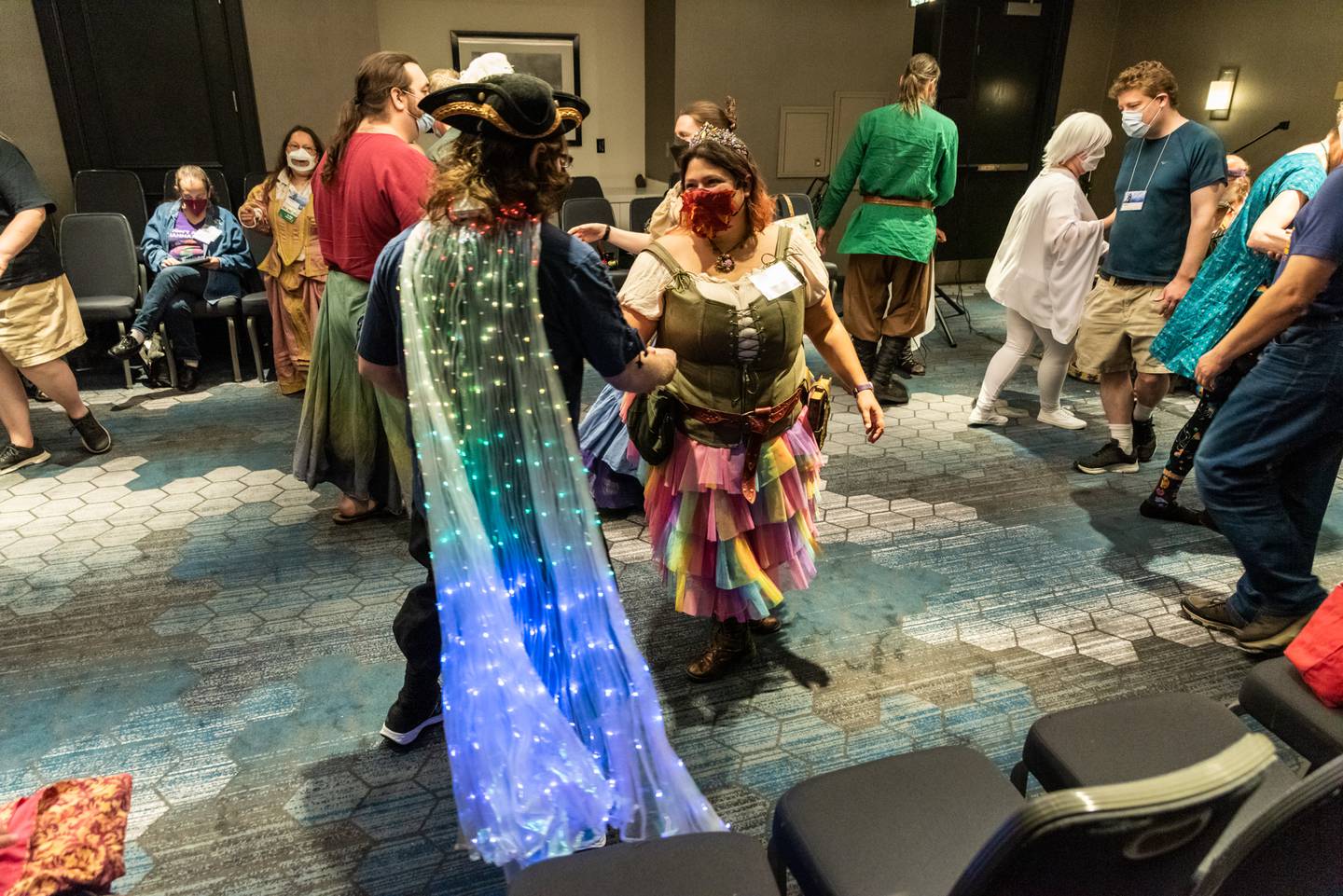 Attendees learn "Upon a Summer's Day", an English country dance, at the Renaissance Dance workshop. Live music performed by Maugorn the Stray (Steve Haug) and Bob and Sue Esty. Balticon 57 at Renaissance Harborplace Hotel, Baltimore, Maryland.