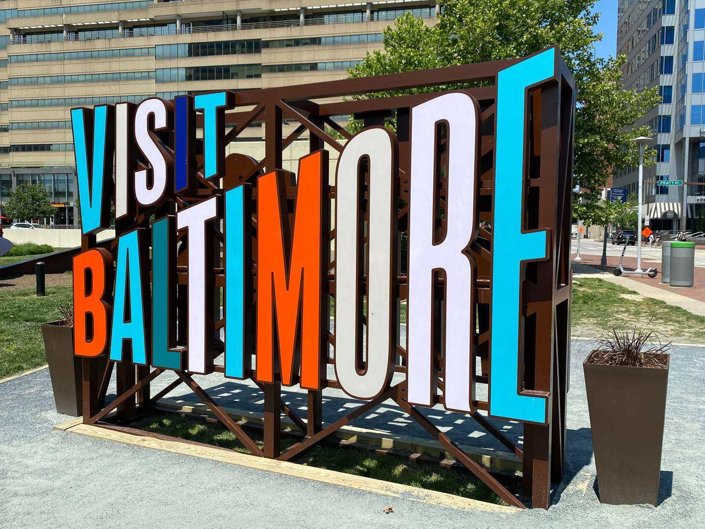 A view of the "Visit Baltimore" sign by Inner Harbor.