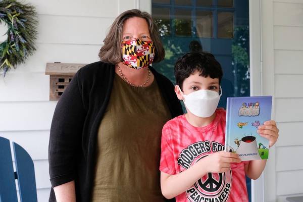 Young local author dedicates colorful caveman tale to supporting cancer patients, like his mom