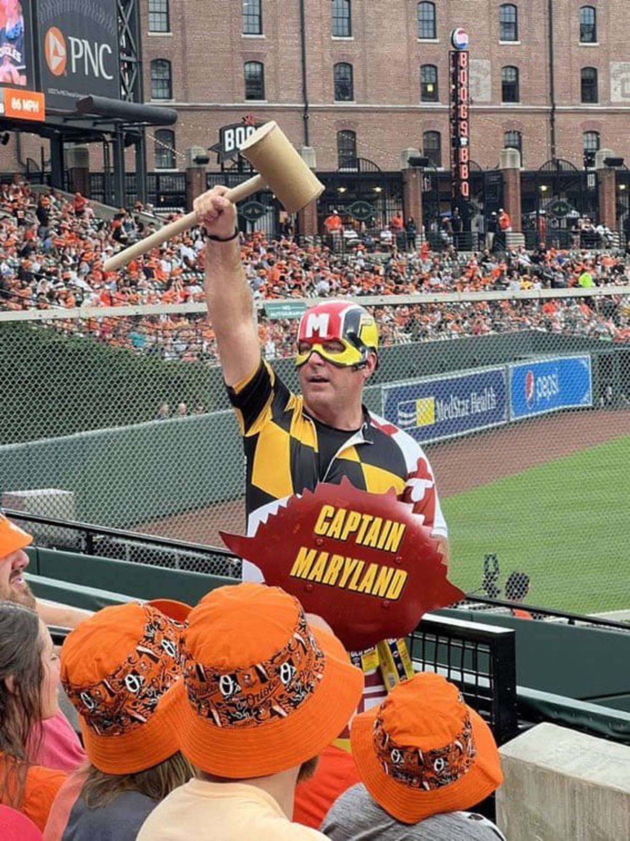 Captain Maryland hyping up the crowd at Camden Yards during an Orioles game.