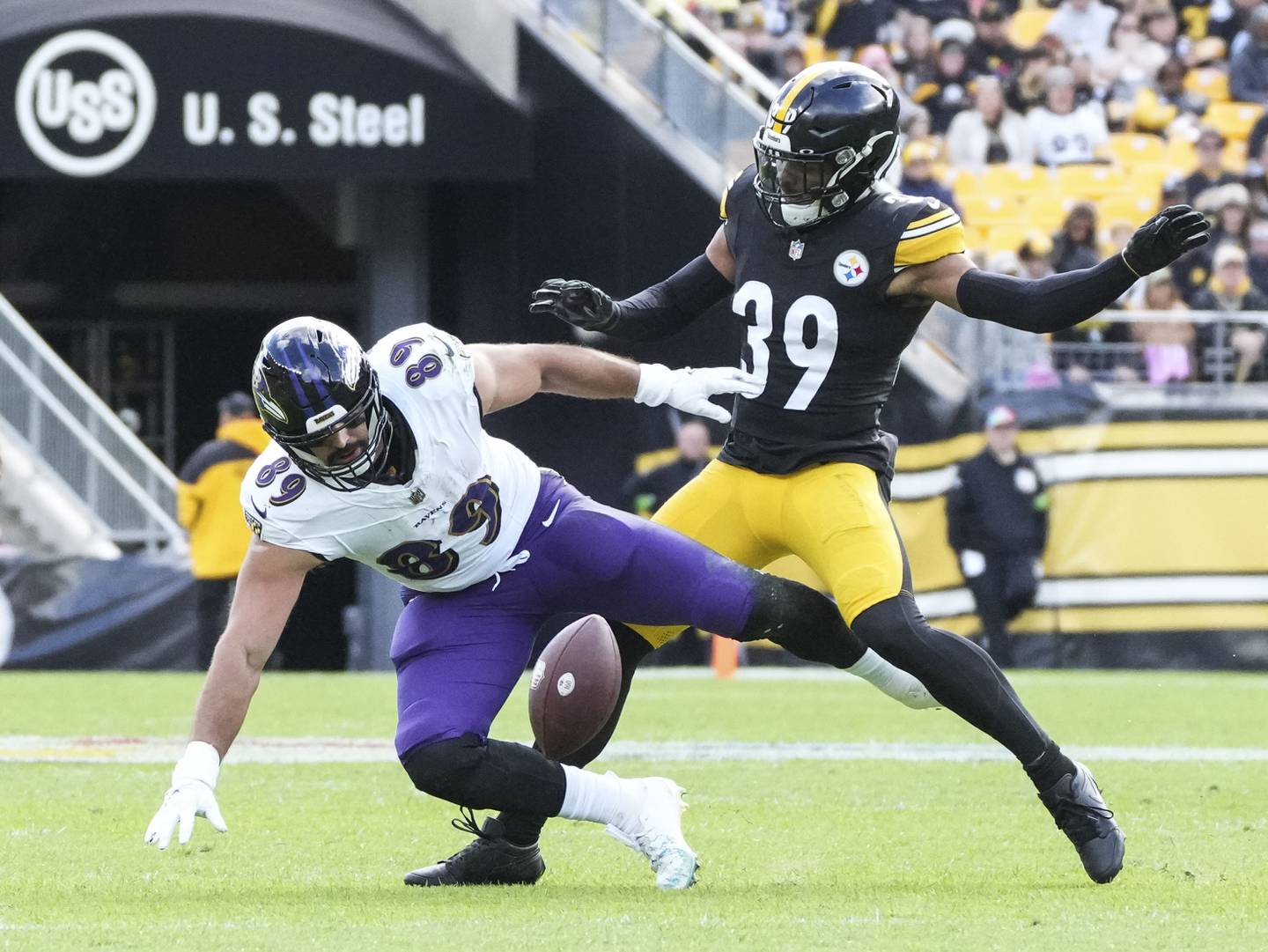 Baltimore Ravens tight end Mark Andrews (89) drops the ball with Pittsburgh Steelers safety Minkah Fitzpatrick (39) following close behind at Acrisure Stadium, in Pittsburgh, PA Sunday, October 8, 2023.