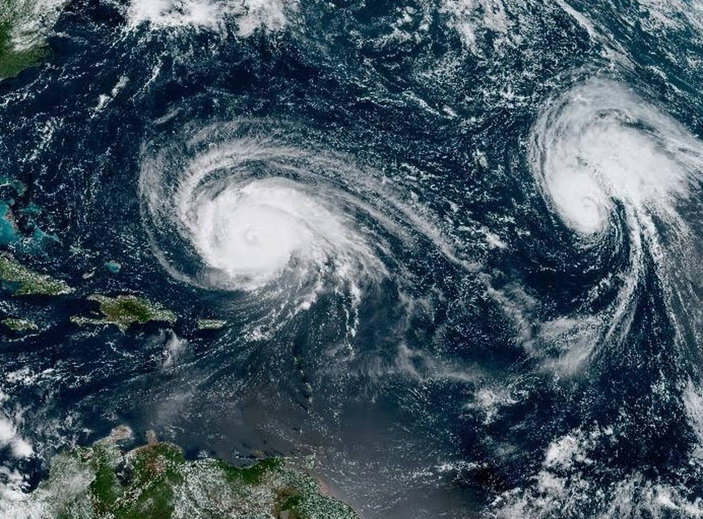 A NOAA satellite image released Monday shows Hurricane Lee churning in the Atlantic Ocean, with tropical storm Margot to its west. The Chesapeake Bay is in the upper northeast corner of the image.