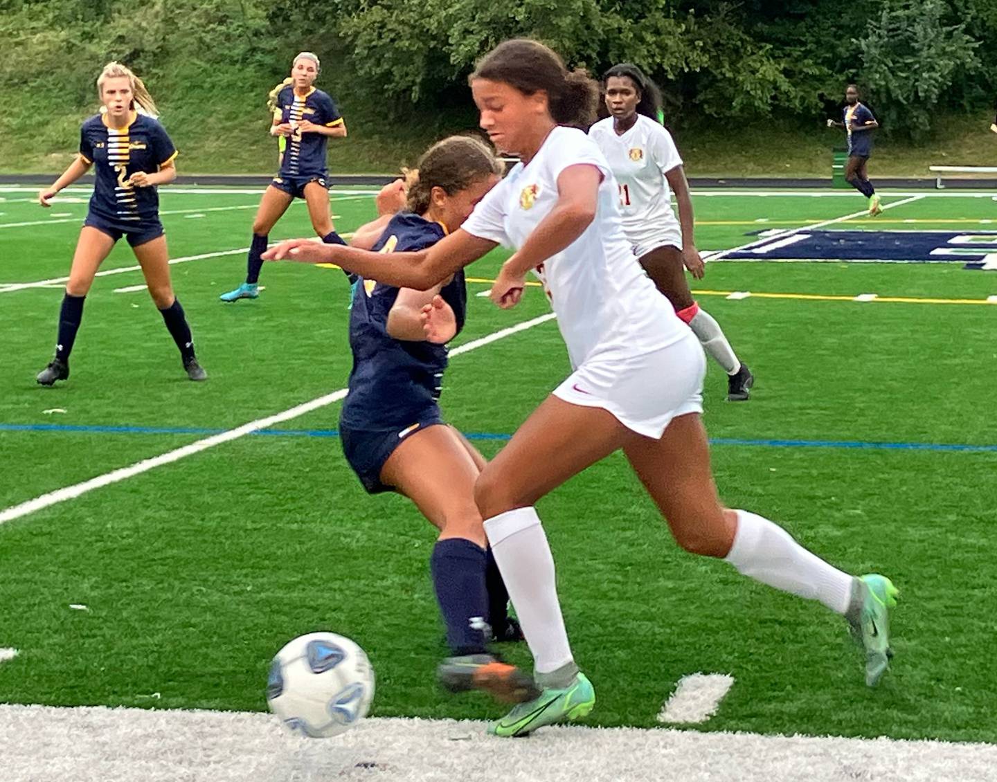 Hereford sophomore forward Aaliyah Stocks bolts up the sideline as Perry Hall senior midfielder Bridgette Asher defends in the 14th-ranked Gators’ 3-2 win on Tuesday.