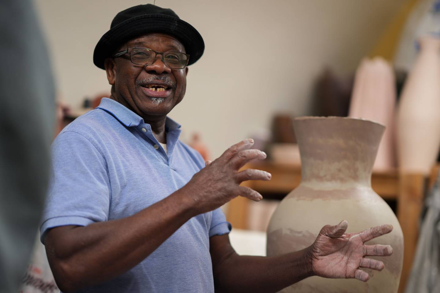 Sam Wallace, a Jamaican-American pottery artist, is interviewed in his section of the Baltimore Clayworks studio on 11/30/22. Wallace has become a mainstay of the local artist community and for columnist Leslie Streeter, buying and giving his pieces has become a holiday tradition.