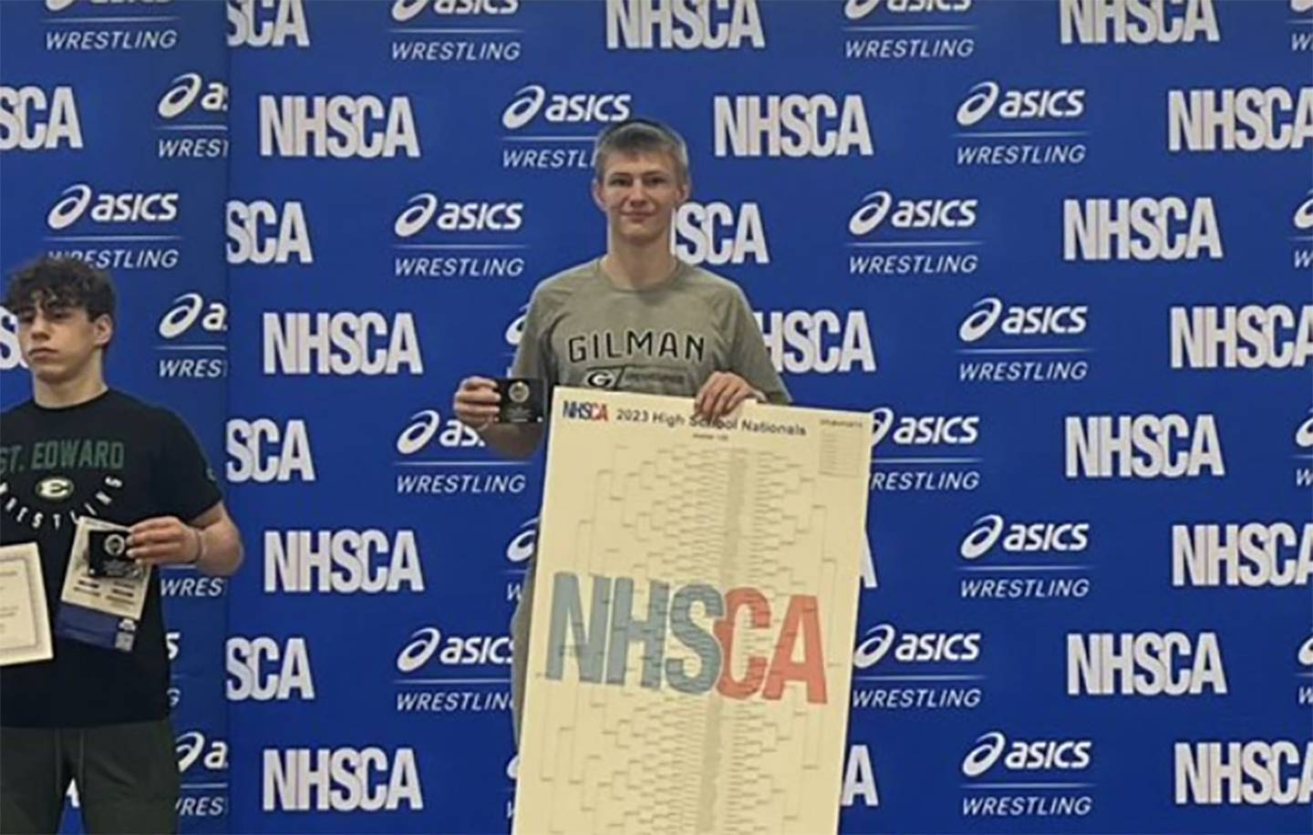 Gilman's Tyson Sherlock stands atop the podium after going 7-0 and winning the 132lbs. weight class at the NHSCA wrestling nationals in Virginia Beach, Virginia.