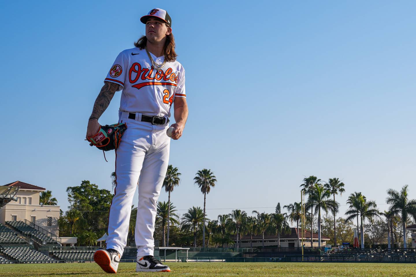 DL Hall (24) walks around the main field as he waits for other teammates to arrive on Photo Day at Ed Smith Stadium in Sarasota on 2/23/23. The Baltimore Orioles’ Spring Training session runs from mid-February through the end of March.