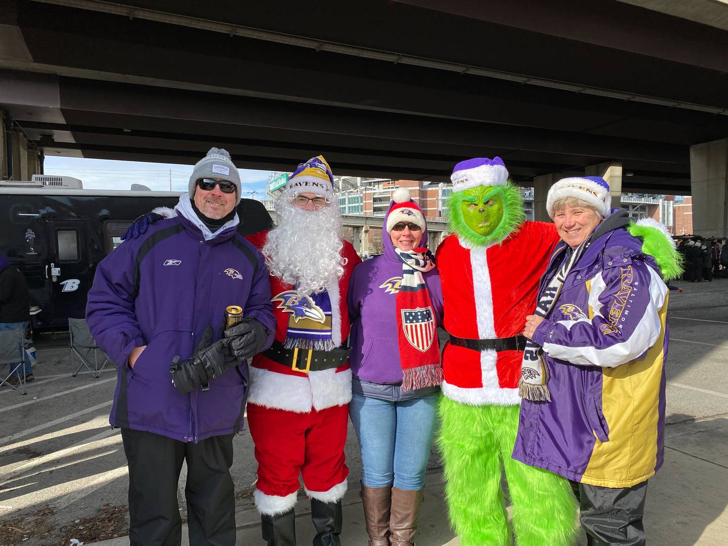 Ravens fans bundle up in purple garb and Christmas costumes ahead of the 1 p.m. game against the Atlanta Falcons.