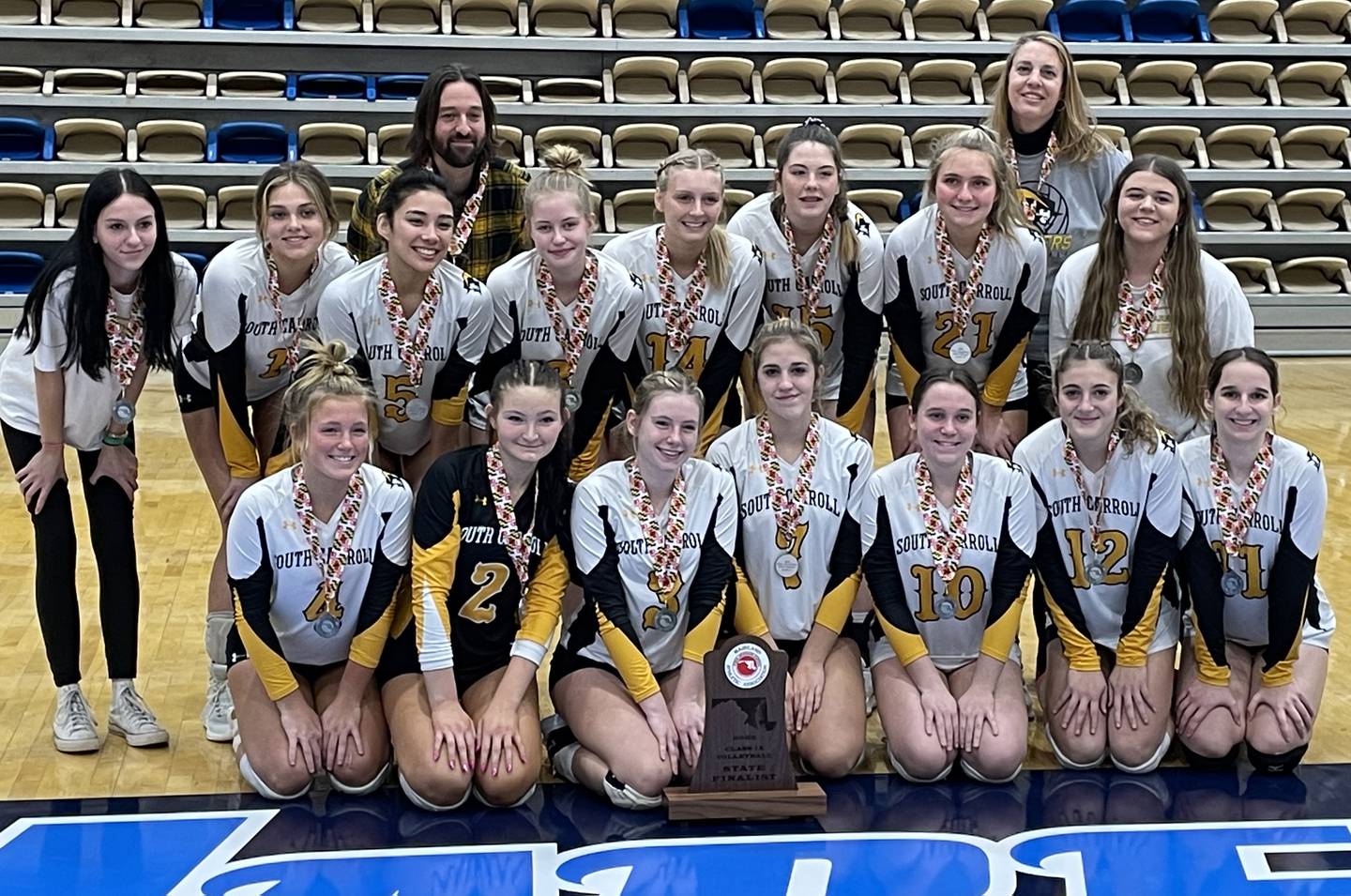 South Carroll volleyball gathered for a team photo with the 1A state runner-up trophy after falling to Clear Spring, in three sets, in the championship match.
