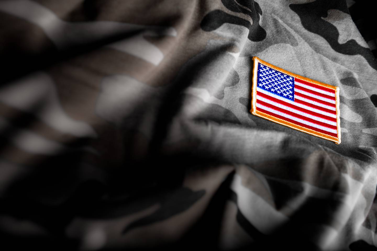 American flag patch on camouflage.