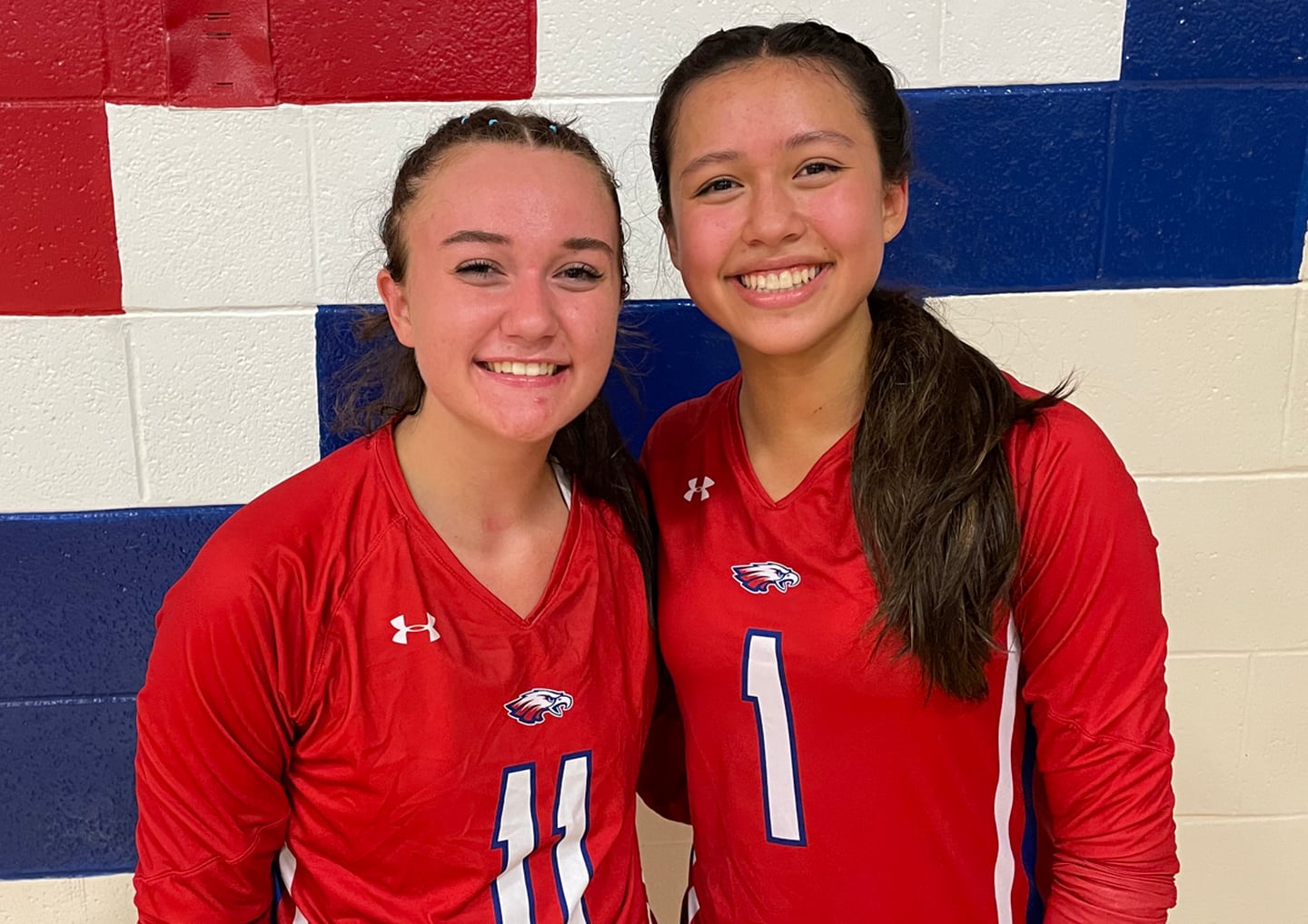 Brianna Bossom (11) and Mailinh Godschall (1) led No. 3 Centennial to a season-opening volleyball victory over No. 9 Howard Tuesday night. Godschall pounded out 12 kills while Bossom had 39 assists.