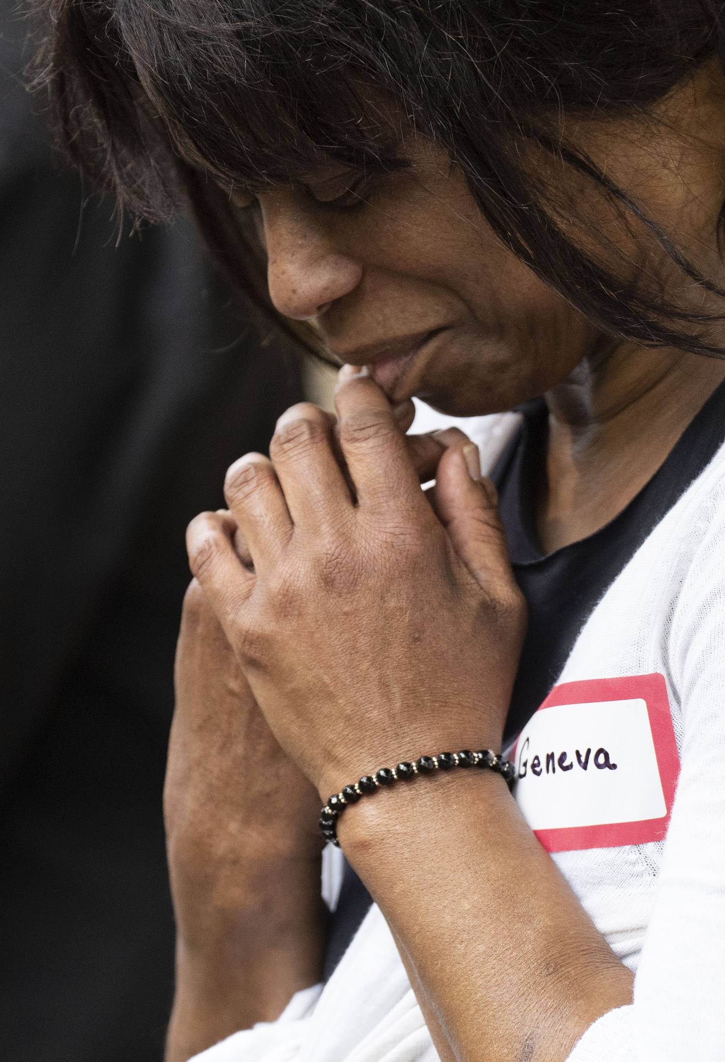 Geneva Parrish prays during Family Life at the YNot Lot in Baltimore, May 11, 2023.
