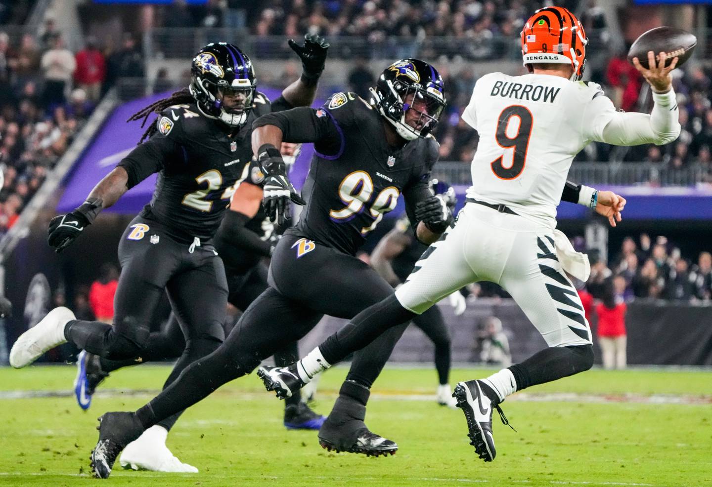 Baltimore Ravens linebacker Odafe Oweh (99) pressures Cincinnati Bengals quarterback Joe Burrow (9) during the second quarter at M&T Bank Stadium on Thursday, Nov. 16, 2023.