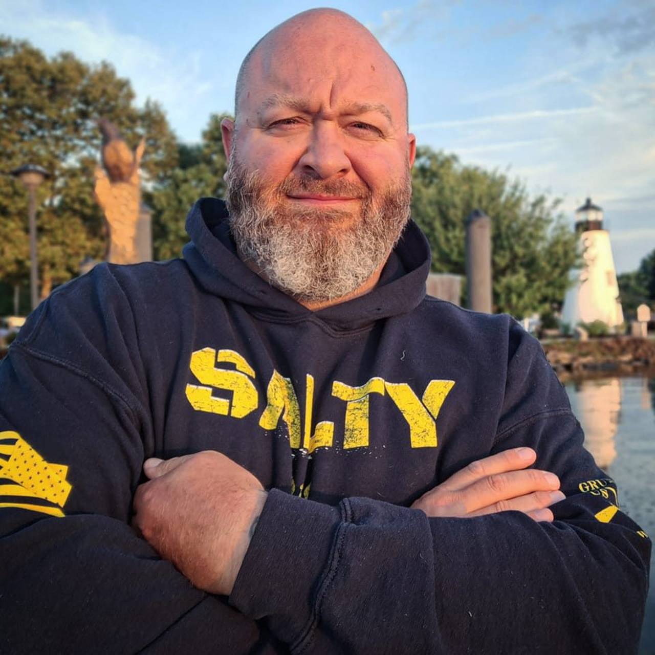 A photo of Blane H. Miller III wearing a blue hoodie with the word "salty" in yellow print on his chest.