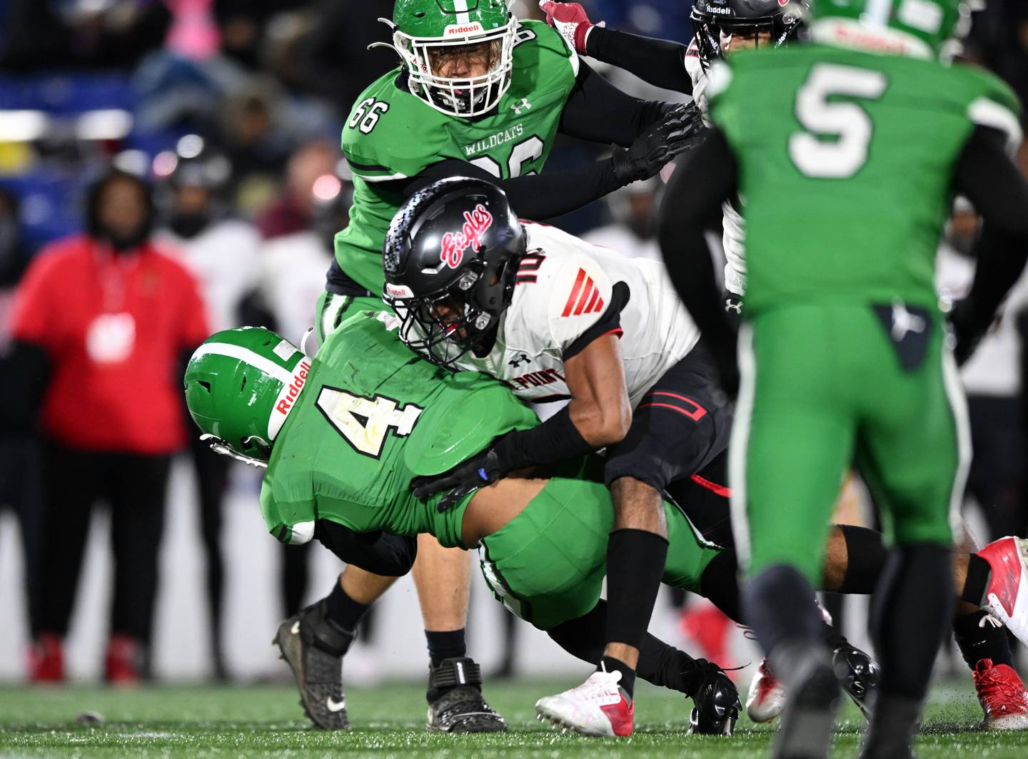 Arundel's Ahmad Taylor (4) is tackled by North Point's Makai Young during Friday's Class 4A/3A state football championship game. The No. 10 Wildcats were unable to climb out of a 17-0 first quarter deficit, falling 31-14 to the Charles County school at Navy-Marine Corps Memorial Stadium in Annapolis.