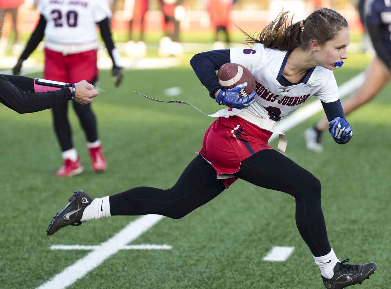 Thomas Johnson’s Olivia Dahl (6) takes the ball down the field while playing against Urbana during the Girls flag semifinals at the Under Armour’s “The Stadium at the House” in Baltimore, Wednesday.