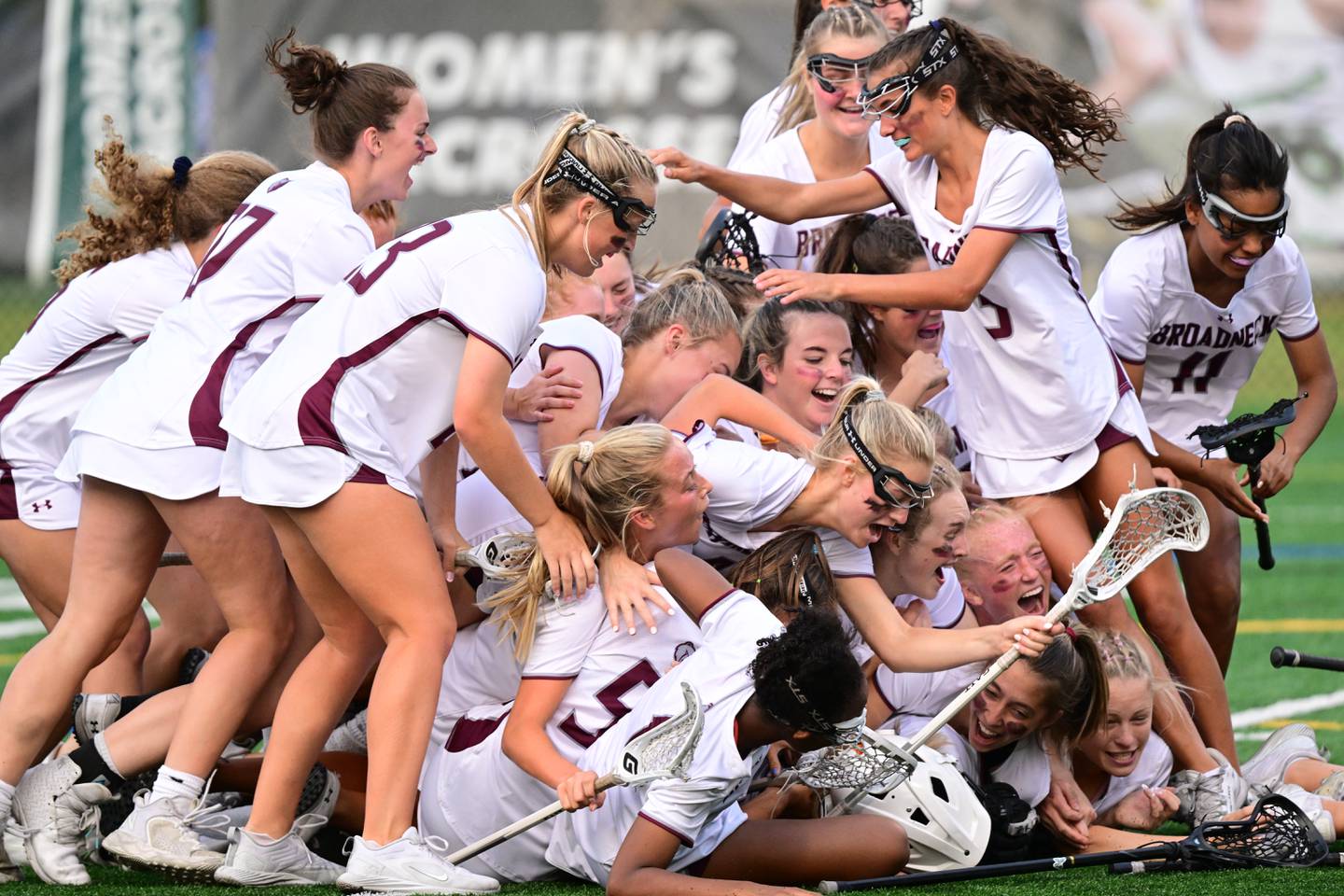 The Broadneck girls lacrosse team piles up in celebration following their 9-8 win over Dulaney in the Class 4A girls lacrosse state championship game at Stevenson University.