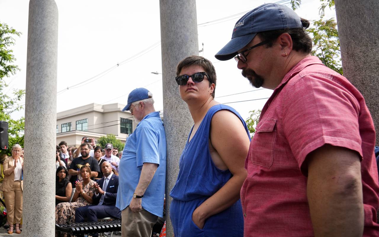 From left: former Capital staffers E.B. “Pat” Furgurson, Rachael Pacella, and current staff photographer Paul Gillespie watch as the audience reacts to Andrea Chamblee, widow of reporter John McNamara, speaking at a ceremony memorializing the victims in the 2018 Capital Gazette shooting on Wednesday, June 28, 2023 in downtown Annapolis. On this day five years ago, a gunman with a grudge against the Annapolis newspaper blasted his way into their newsroom, killing five staffers inside. He is serving numerous life sentences with no chance of parole.