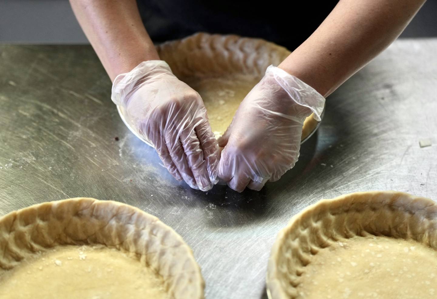 Pie crust gets perfected a the popular pie shop at Dangerously Delicious. (Kaitlin Newman / The Baltimore Banner)