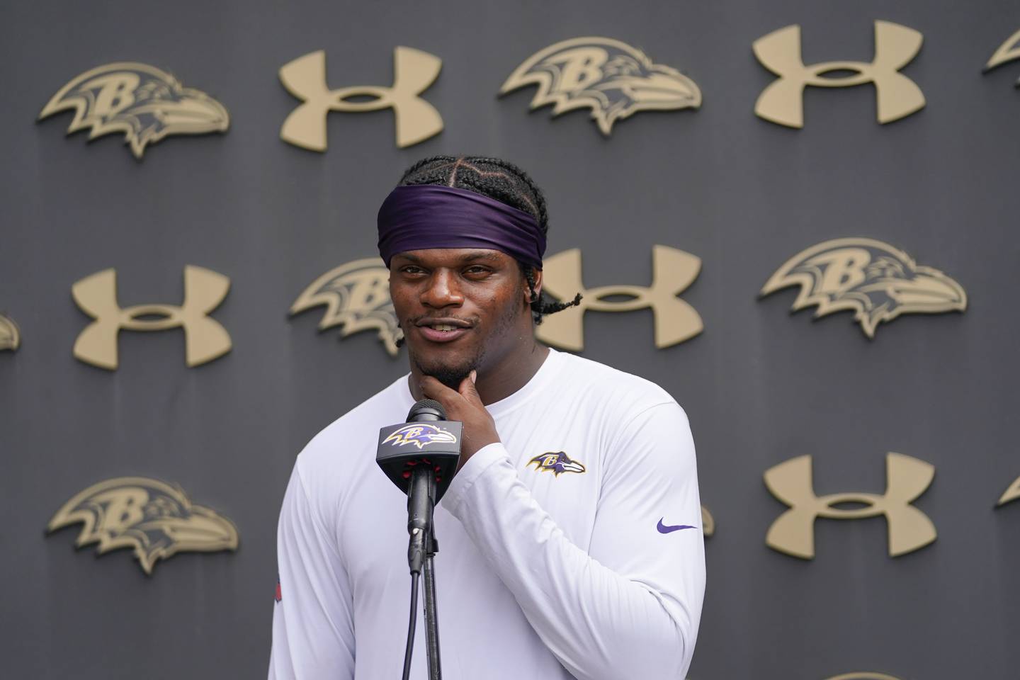 FILE - Baltimore Ravens quarterback Lamar Jackson talks to reporters during the team's NFL football training camp, Thursday, July 28, 2022, in Owings Mills, Md. The Baltimore quarterback is still without a contract extension beyond this season. (AP Photo/Julio Cortez, File)
