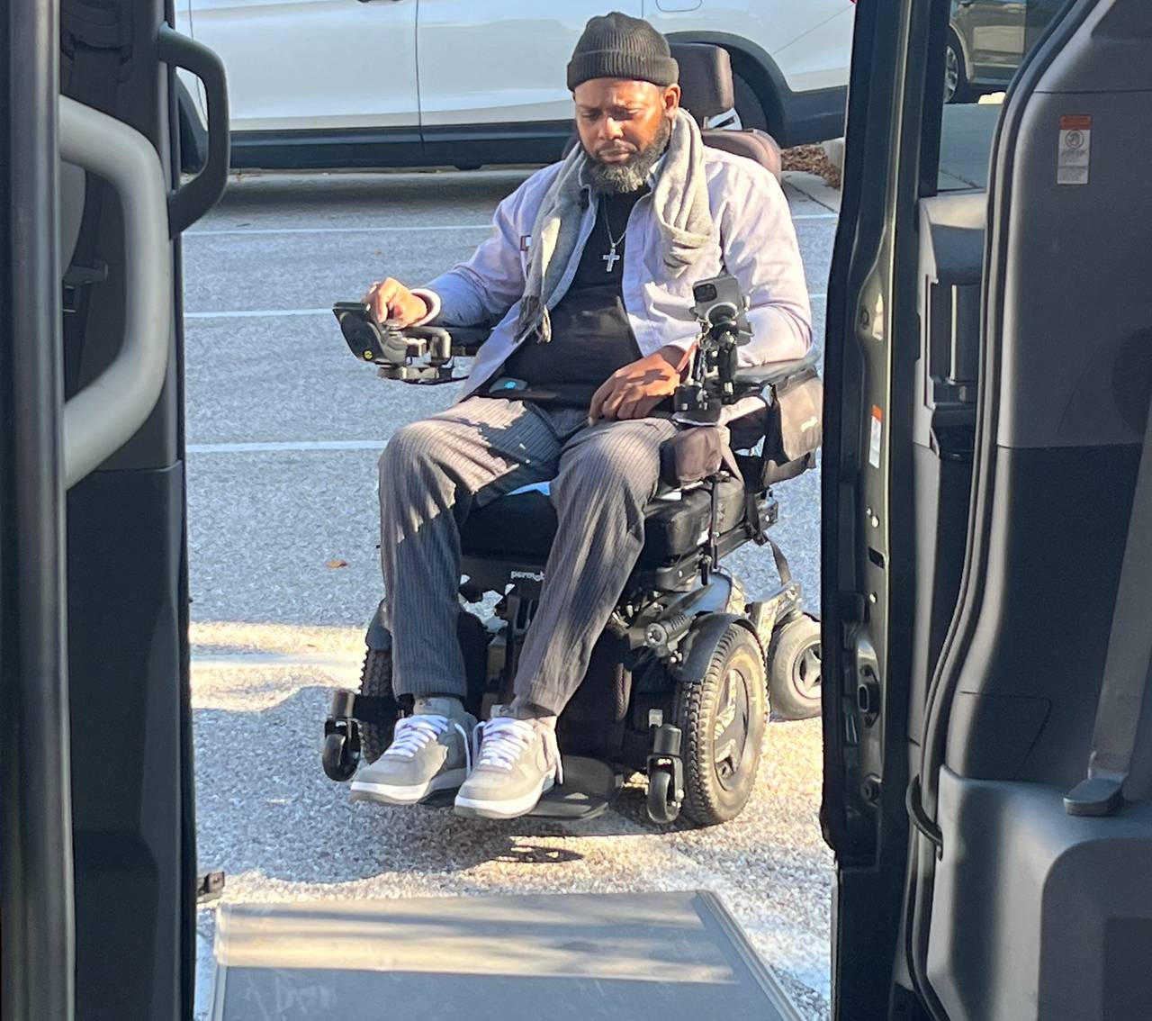 With the push of a button, the door to Baltimore Police Sgt. Isaac “Ike” Carrington’s van opens up, and a ramp deploys onto the asphalt. He guides his wheelchair up and inside, positioning himself where the driver’s seat would normally be.