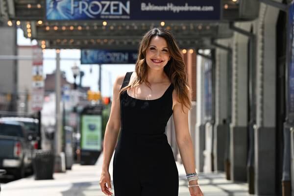 Caroline Bowman is photographed in front of the Hippodrome theater Tuesday, May 16, 2023 in Baltimore. Bowman stars in the Hippodrome’s “Frozen” which begins in June.
