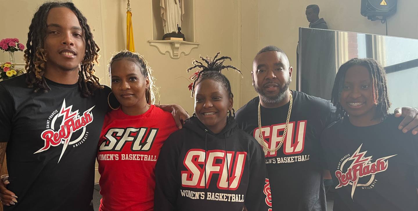 Kameryn Dorsey (center) is flanked by brother Rajier Jones (left), mother Katrina Powell, father Damon Dorsey and sister Daimoni Dorsey after her signing ceremony last week. The senior guard signed a scholarship with St. Francis University of Pennsylvania.