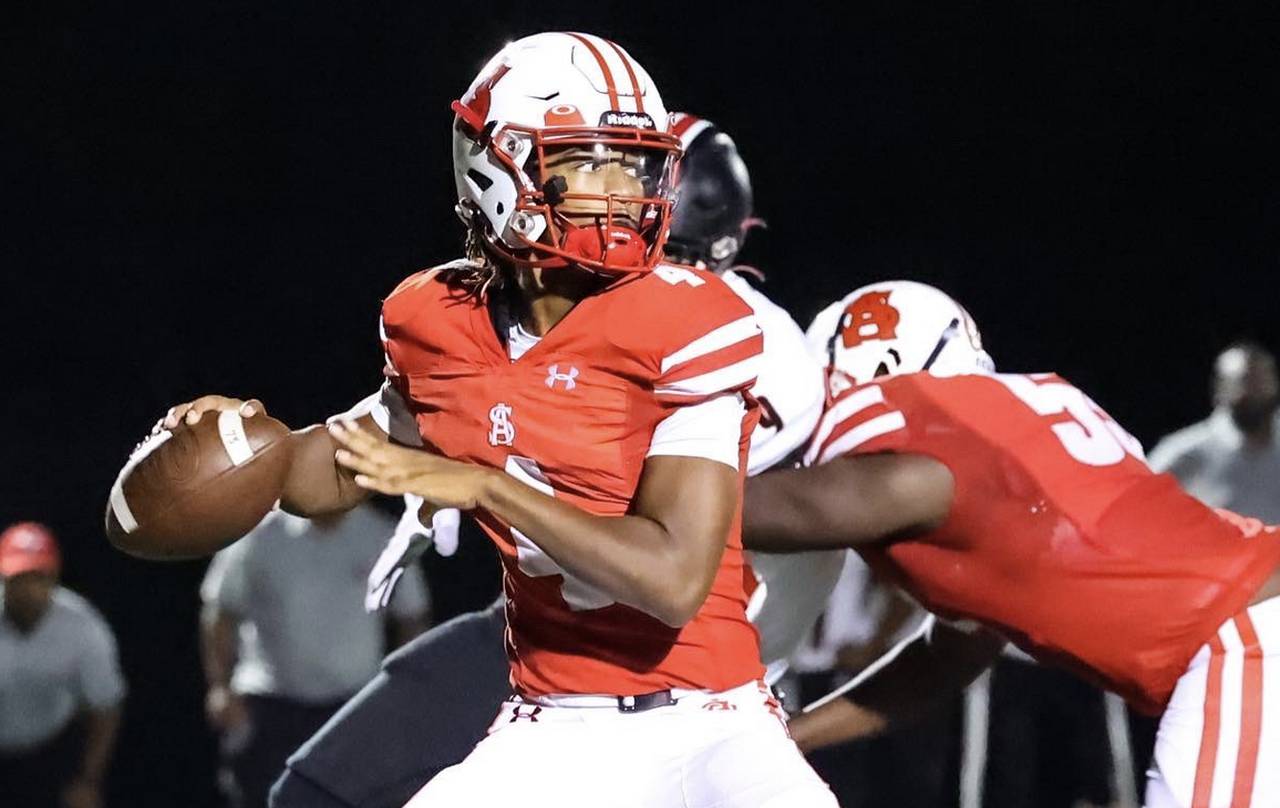 Quarterback Malik Washington looks to pass as No. 2 Archbishop Spalding got into the win column Friday night with an impressive win over Imhotep (PA).