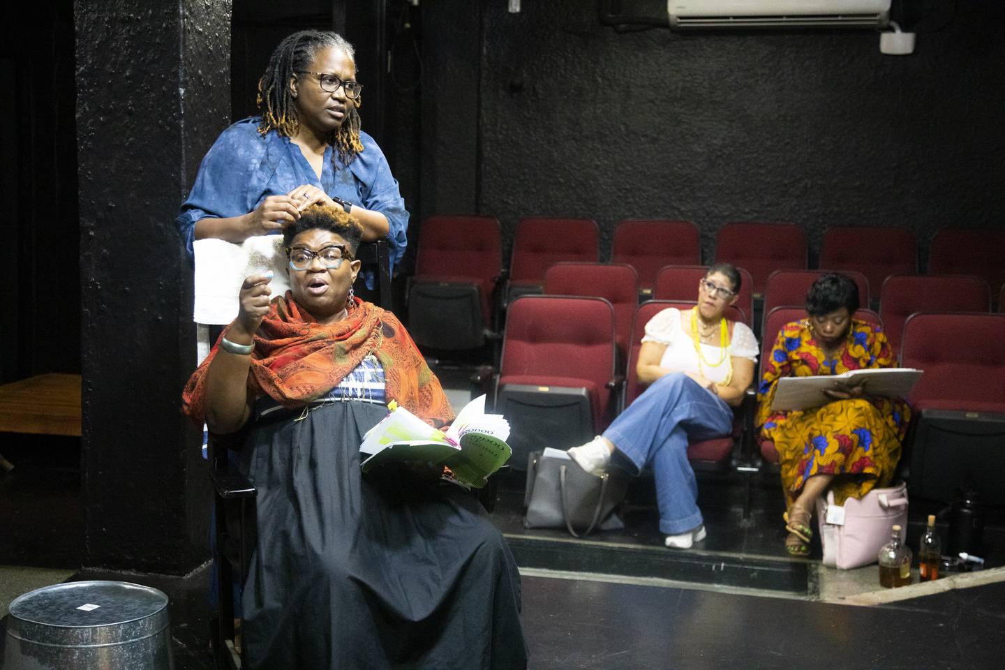 (Standing) Sharon Carter Brown does (seated) Andromeda Bacchus’ hair with director Rain Pryor and assistant director Radiance Pittman during the rehearsal of “Hoodoo Love.”