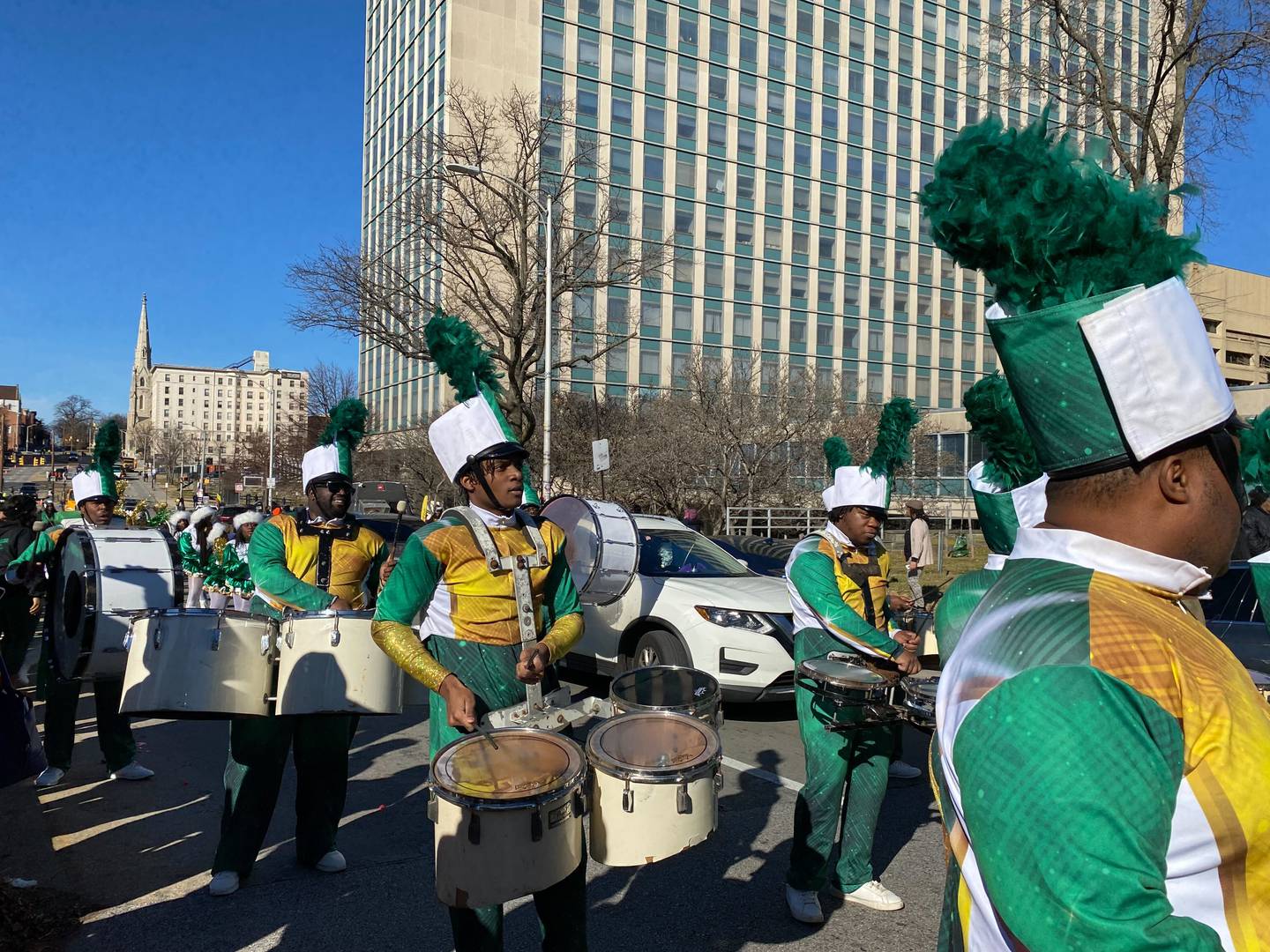 Members of the Baltimore Twilighters, a nonprofit community marching band, take part in Baltimore's MLK Day parade under blue skies on Jan. 16, 2022.