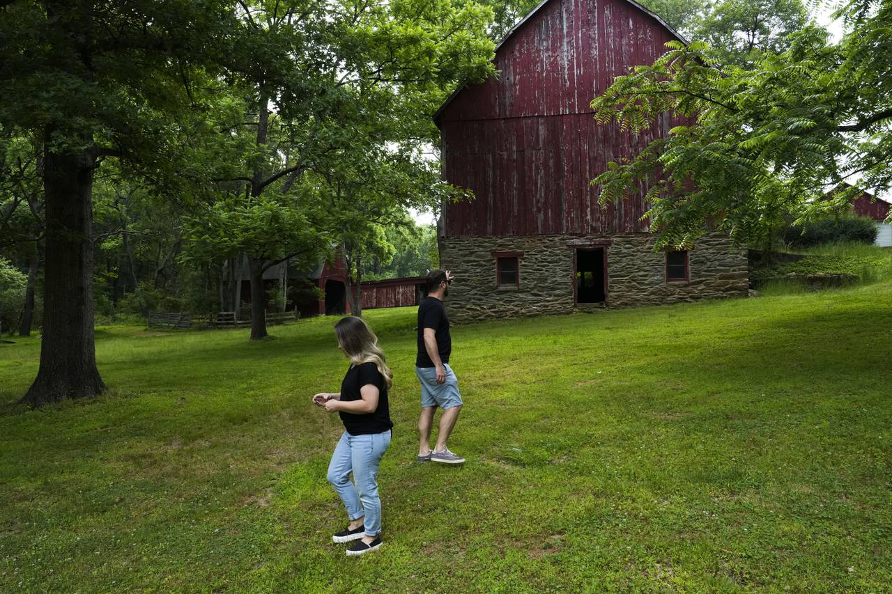 Dani and Justin Ritthaler are pictured here on June 9. 2023 walking around the expansive property.